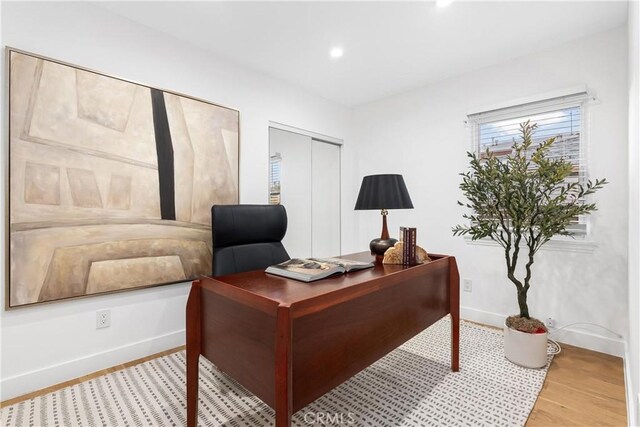 office space with light hardwood / wood-style floors