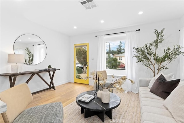 living room with light hardwood / wood-style floors