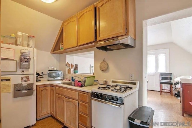 kitchen featuring lofted ceiling, light hardwood / wood-style flooring, white appliances, and ventilation hood