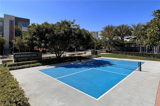 view of tennis court featuring basketball court