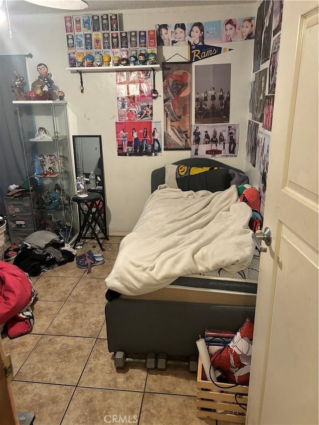 bedroom featuring tile patterned flooring