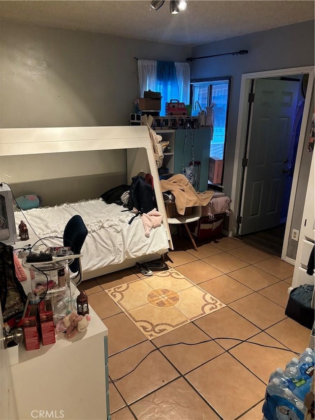 bedroom featuring tile patterned floors