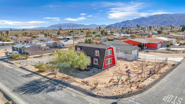 birds eye view of property featuring a mountain view