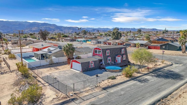 birds eye view of property featuring a mountain view