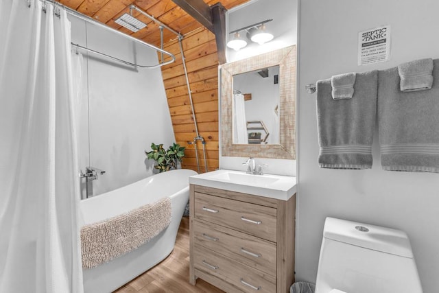 bathroom with hardwood / wood-style flooring, vanity, wood ceiling, and wood walls