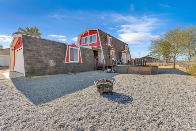 view of front of property with a fire pit