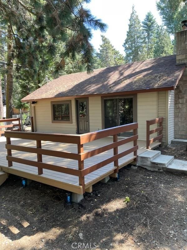 exterior space featuring a wooden deck