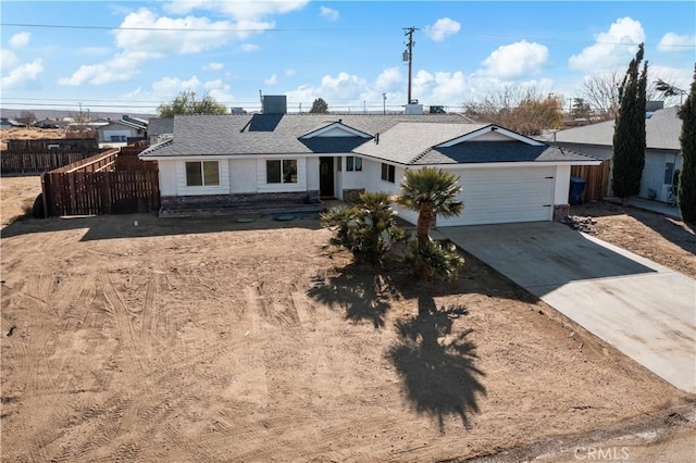 ranch-style house featuring a garage