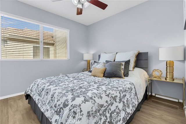 bedroom featuring ceiling fan and hardwood / wood-style flooring