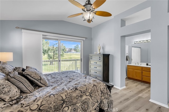 bedroom featuring ensuite bath, access to outside, vaulted ceiling, ceiling fan, and light hardwood / wood-style flooring