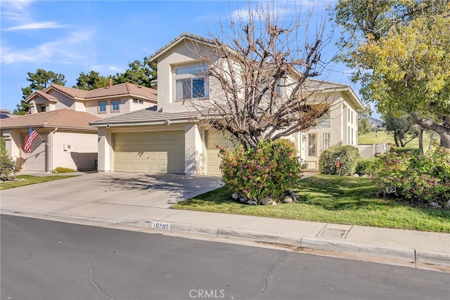 view of front of property with a garage and a front yard