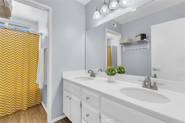 bathroom featuring vanity and hardwood / wood-style flooring