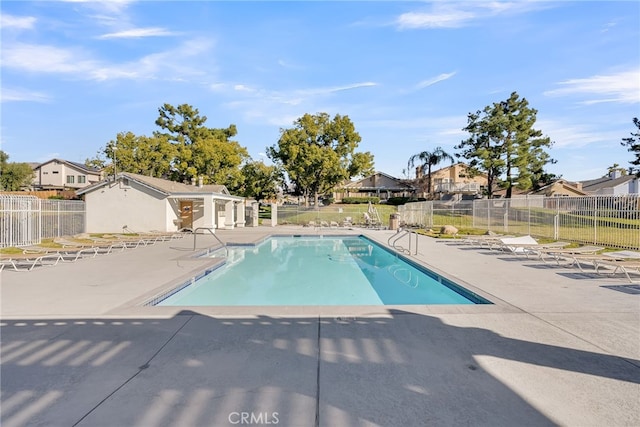 view of swimming pool featuring a patio area