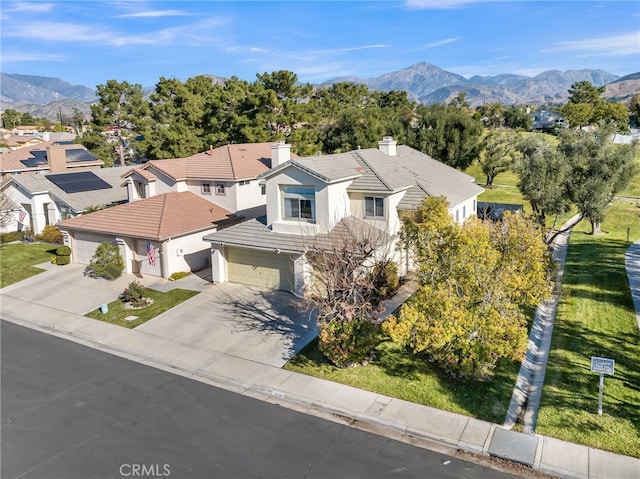 birds eye view of property featuring a mountain view