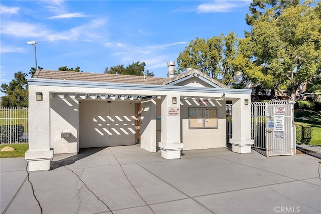 garage featuring a carport