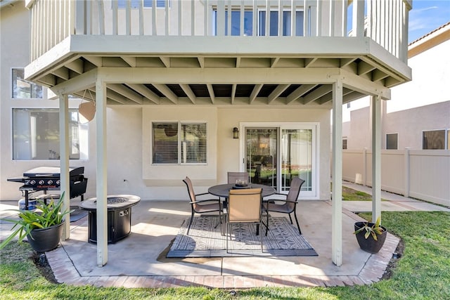 view of patio / terrace with a balcony and area for grilling