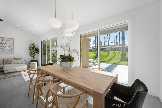 dining area with lofted ceiling