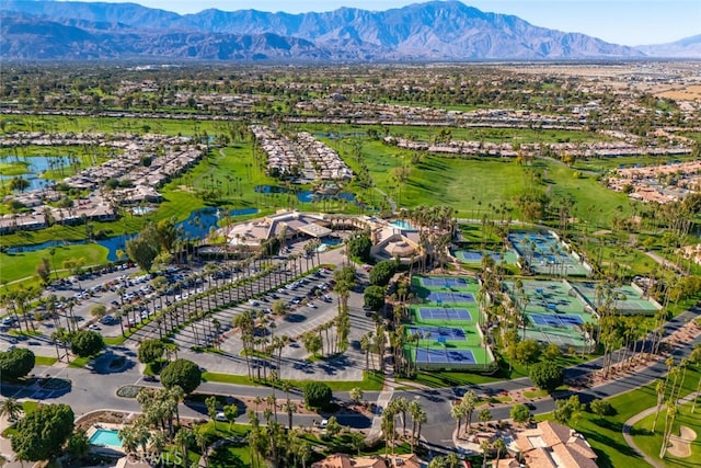 birds eye view of property with a water and mountain view