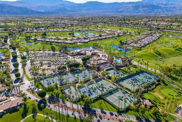 drone / aerial view with a water and mountain view