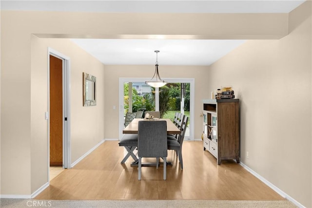 dining area with light wood-type flooring