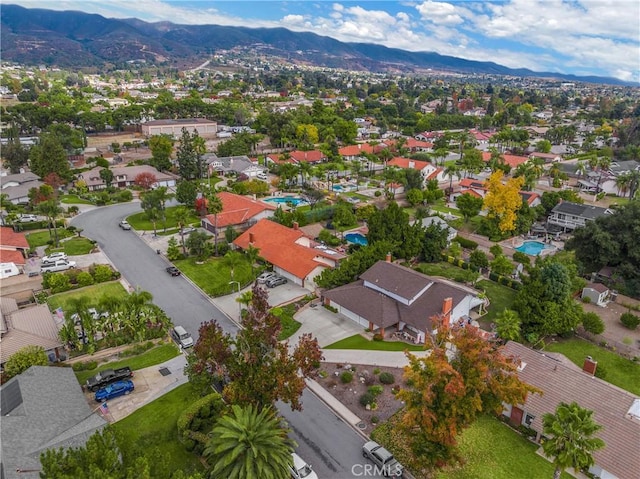 birds eye view of property featuring a mountain view