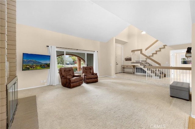 carpeted living room featuring a fireplace