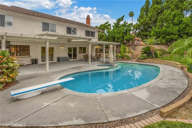 view of swimming pool with a pergola, a patio area, a diving board, and an in ground hot tub