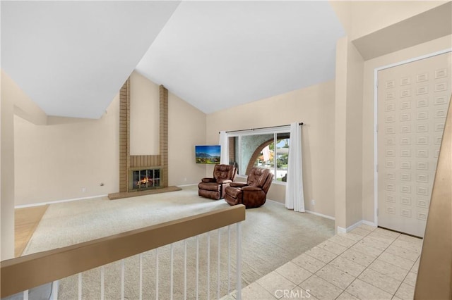 living area with light colored carpet, vaulted ceiling, and a brick fireplace