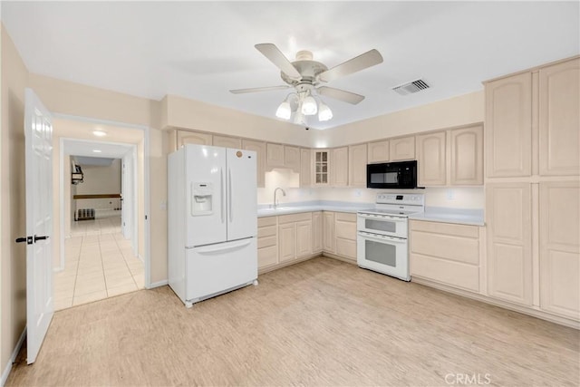 kitchen with ceiling fan, sink, light hardwood / wood-style floors, and white appliances