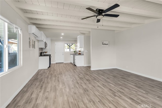 unfurnished living room featuring ceiling fan, a wall mounted air conditioner, light hardwood / wood-style flooring, beamed ceiling, and wood ceiling