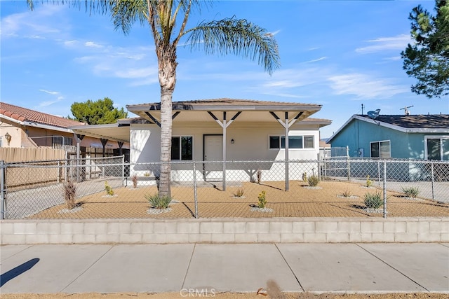 view of front of property featuring a carport