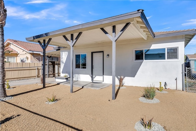 rear view of house featuring a patio area