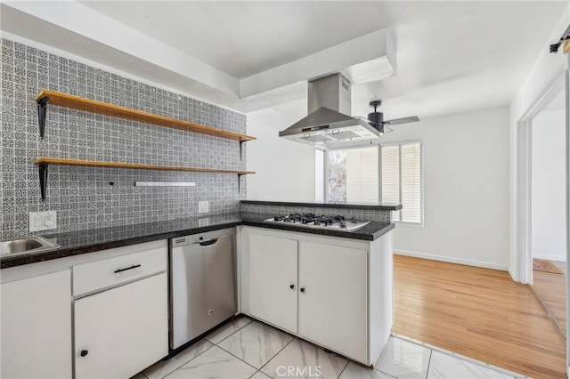 kitchen featuring tasteful backsplash, dishwasher, gas cooktop, island exhaust hood, and white cabinets