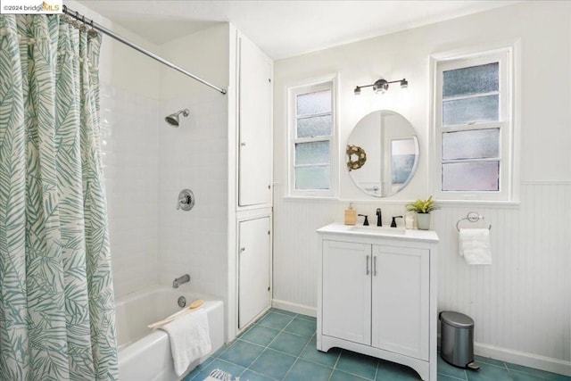 bathroom with vanity, shower / bathtub combination with curtain, and tile patterned flooring