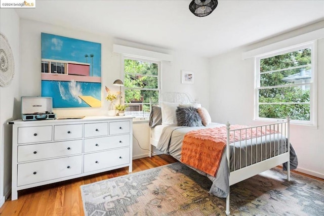 bedroom with wood-type flooring