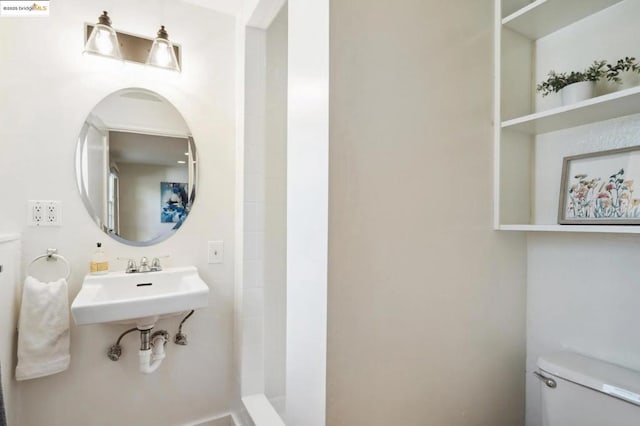 bathroom with toilet and sink