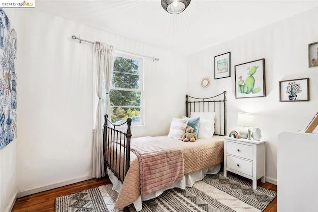 bedroom featuring dark hardwood / wood-style flooring