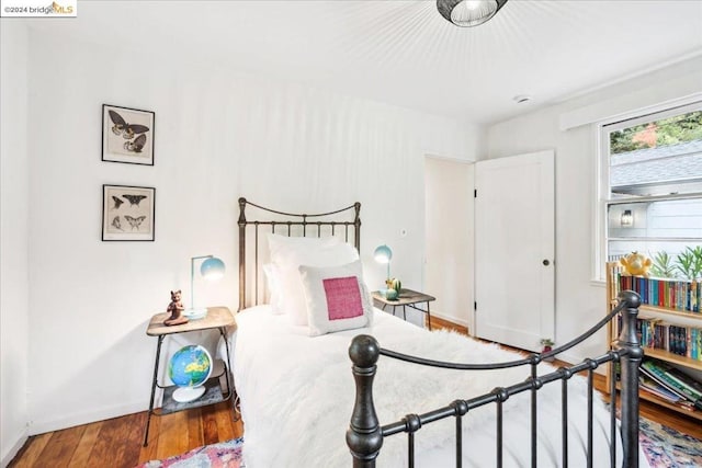 bedroom featuring hardwood / wood-style flooring