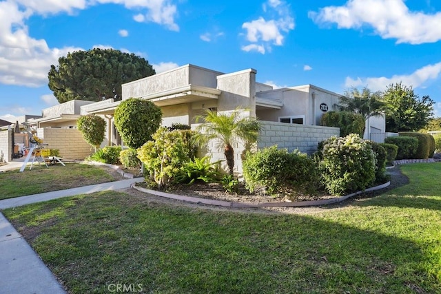 view of side of property featuring a yard