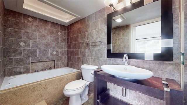 bathroom featuring toilet, tile walls, and sink