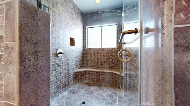 bathroom featuring tiled shower