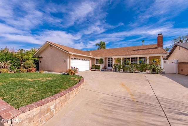 ranch-style home with a front yard and a garage