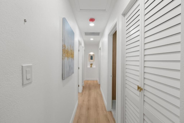 hall with light hardwood / wood-style flooring