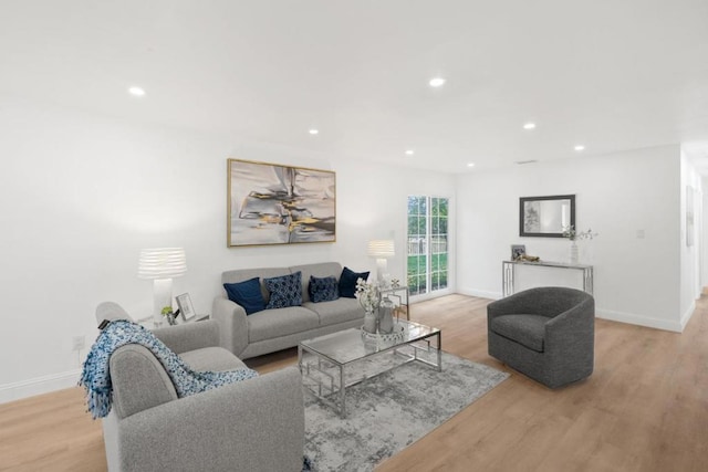 living room with light hardwood / wood-style floors