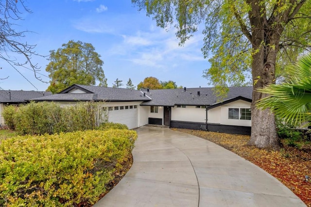 ranch-style home featuring a garage