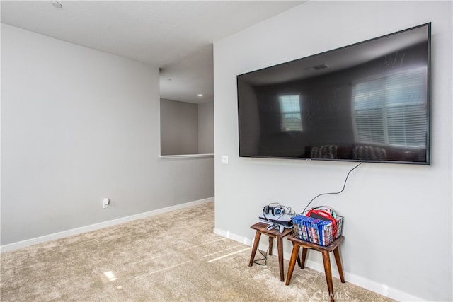 unfurnished room featuring carpet flooring and baseboards
