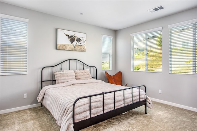 bedroom featuring light colored carpet