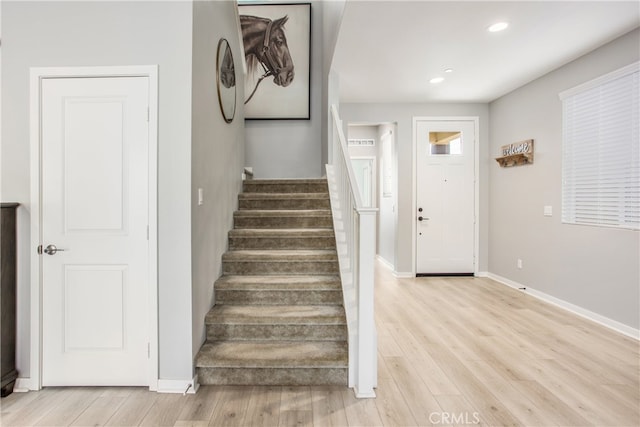 staircase featuring hardwood / wood-style floors