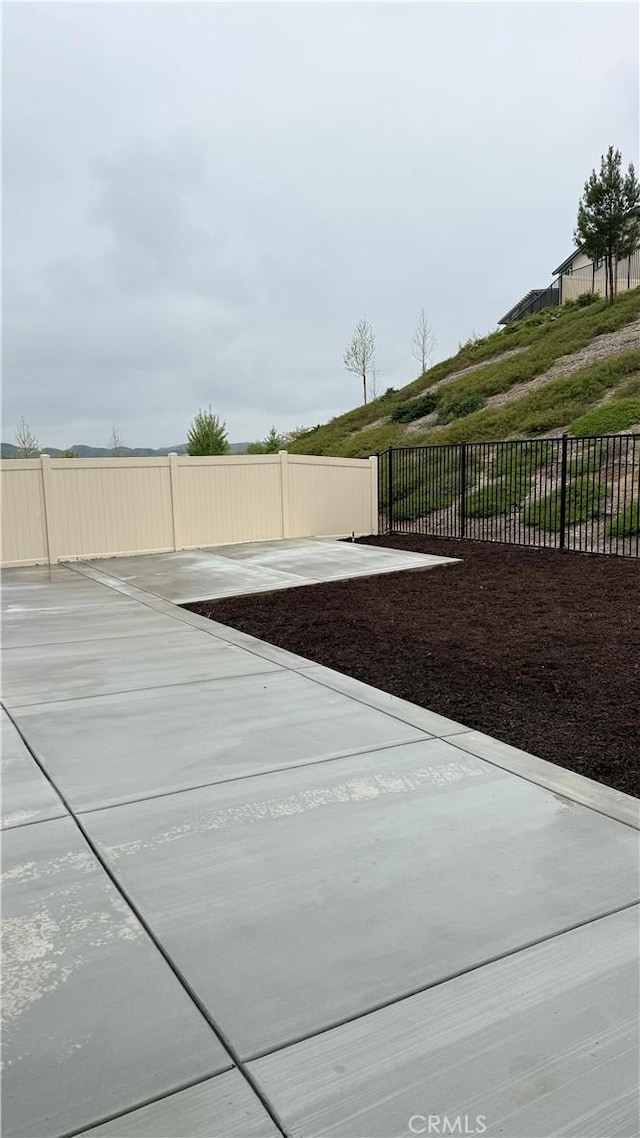 exterior space featuring fence and a patio area