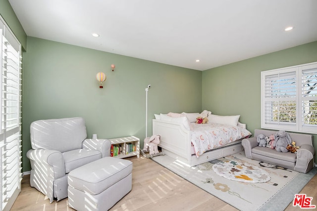 bedroom featuring light wood-type flooring